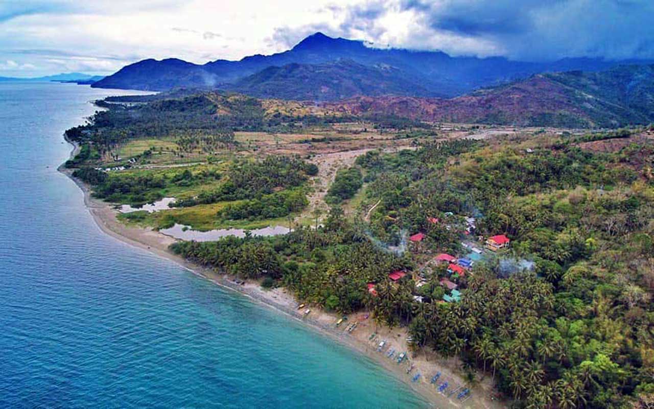 Drone view from Munting Buhangin Beach past Udalo east to Puerto Galera
